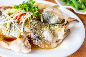 Chinese gourmet dishes, steamed squid on a plate at the table