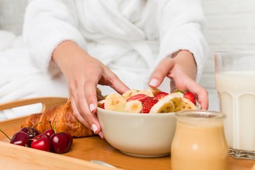 Young caucasian woman having breakfast