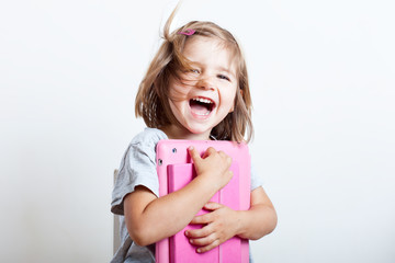 little  girl with tablet  and diary ready to school