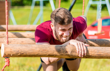Extreme obstacles overcome by runner in the boot camp