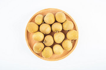 Fresh fruit longan on a plate on white background