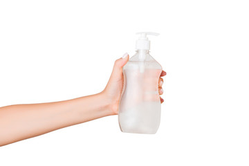 Female hand holding cream bottle of lotion isolated. Girl give cosmetic products on white background