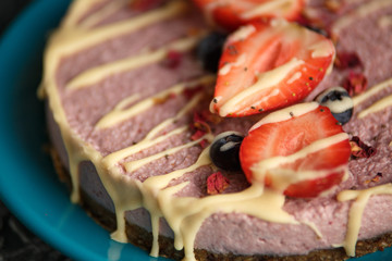 Raw healthy vegan cheesecake, homemade with cashew, mint and strawberries