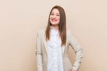 Obraz premium Young business woman happy, smiling and cheerful.