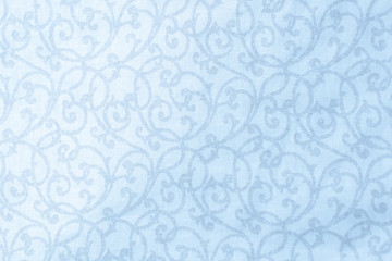 The pale pattern on the fabric with place for text