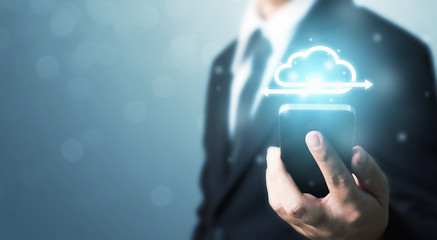 Cloud computing and technology network connection concept. Businessman hand holding mobile smart phone cloud server tranfer data device