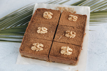 Vegan sweet potato brownie on white table. Healthy vegan food concept.