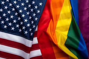 Pride rainbow lgbt gay flag and US american flag . Equality diversity freedom in USA concept. - obrazy, fototapety, plakaty