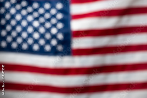 USA American United States flag defocused blurred bokeh backdrop.