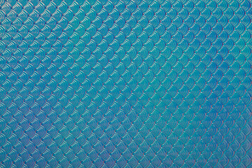 Holographic mermaid fish scales iridescent faux leather texture abstract background.