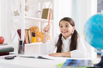 Exited child doing homework and finding solution at home