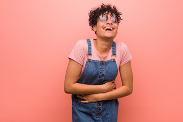 Young mixed african american teenager woman laughing and having fun.