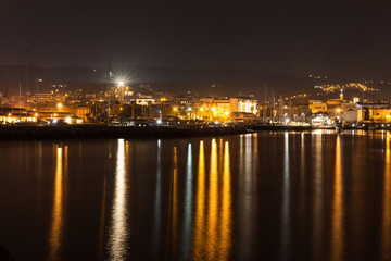 Fototapeta na wymiar Night view of the pier of San Benedetto del Tronto, a beautiful vacation town in the Adriatic coastline