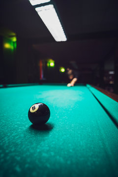 Man playing billard on a pool table