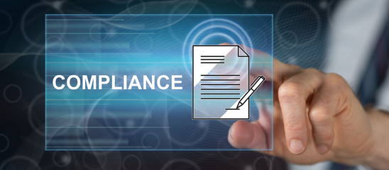 Man touching a compliance concept