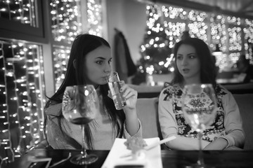 The girl in the evening in a cafe