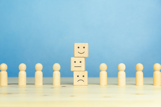 Wooden blocks with the happy face smile face symbol symbol on the table, evaluation, Increase rating, Customer experience, satisfaction and best excellent services rating concept with copy space