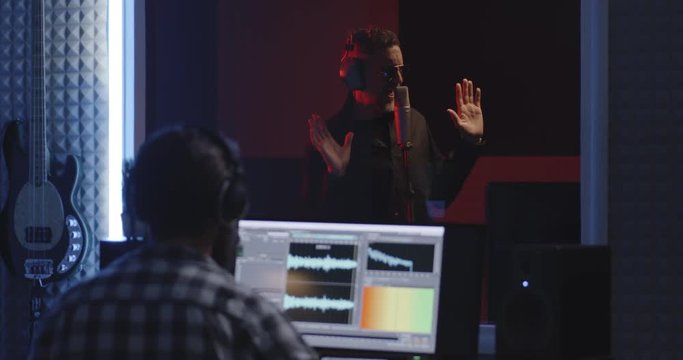 Actor doing voice over in sound studio