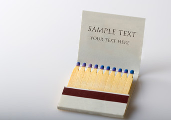 Open matchbox book full of matches