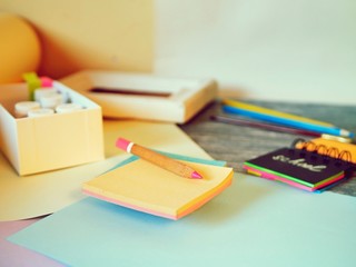 School supplies, frame, inscription in notebook on a wooden table, preparation for learning, education