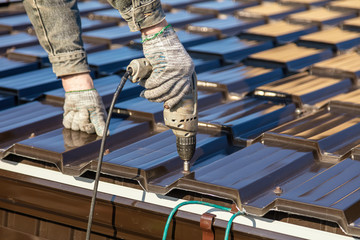 Installation of metal drain on the roof of the house