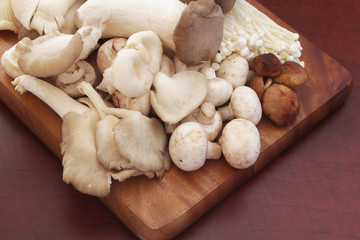 Assorted mushrooms on wooden board