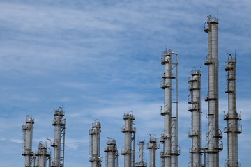oil refinery at sunset