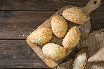 Buns with sesame seeds. Pastry. Rustic style