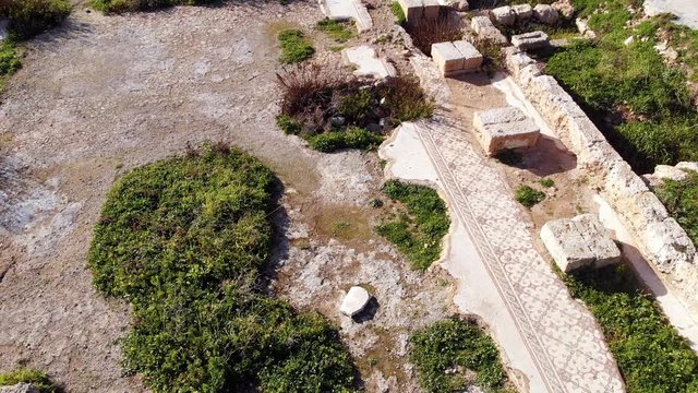 Tel Shikmona is an ancient tell (mound) situated near the sea coast on the modern city of Haifa, Israel. View from the drone of the archaeological site of an ancient settlement.