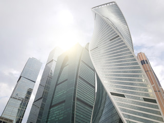 Image from below of tall buildings and blue sky