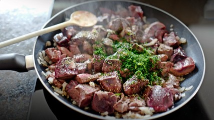 fresh cooking at home roasted liver, heart and kidneys from the red deer