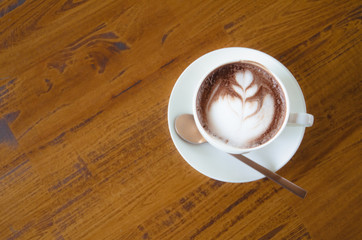 Black coffee is in a white glass, placed on a black background.In top view.Copy Space.
