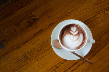 Obraz premium Black coffee is in a white glass, placed on a black background.In top view.Copy Space.