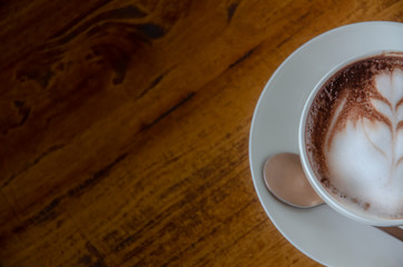 Black coffee is in a white glass, placed on a black background.In top view.Copy Space.