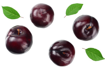 fresh plum fruit with green leaf and cut plum slices isolated on white background. top view