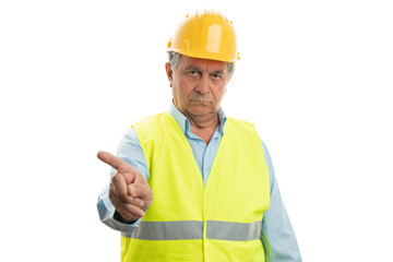 Man with serious expression pointing above