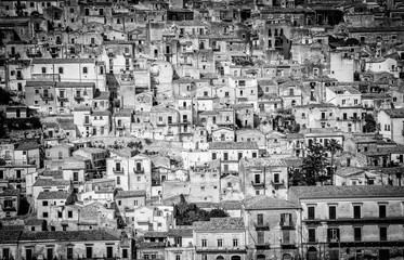 The old houses of Modica, a town in Sicily. Monochrome