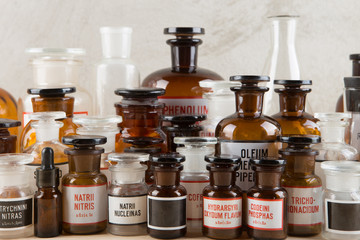 Retro pharmacy - vintage pharmacy bottles on wooden board