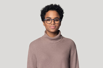 Headshot of black woman in glasses posing isolated in studio - Powered by Adobe