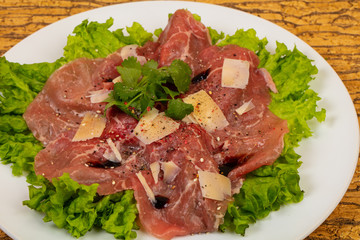 Beef carpaccio with parmesan cheese