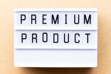 Lightbox with word premium product on wood background