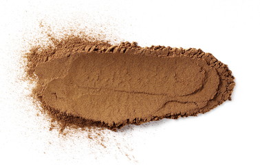 Cinnamon powder isolated on white background, top view