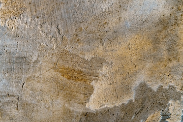 Art rough stylized texture banner with space for text. Yellow background texture decorative plaster. Grungy concrete wall with multi-colored lighting. Old gray surface with blurred edges.