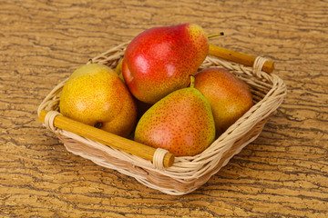 Pear heap in the wooden basket