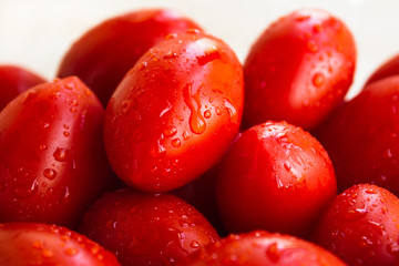 Ripe homemade cherry tomatoes close up. Fresh crop of vegetables, farming