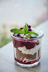 dessert with chocolate and berries in the glass