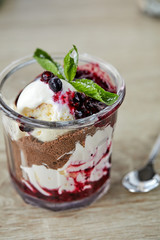 dessert with chocolate and berries in the glass