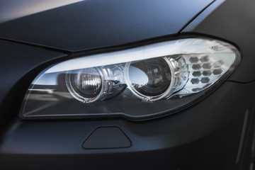 Obraz na płótnie Canvas Modern led headlight ofÂ dark car