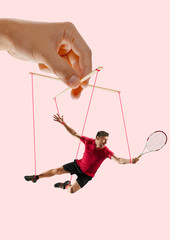 Man like a puppet in somebodies hands on coral background. Concept of unfair manipulation,...