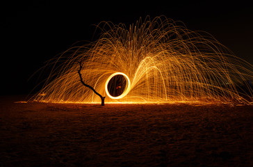 Fire ball long exposure using steel wool at night